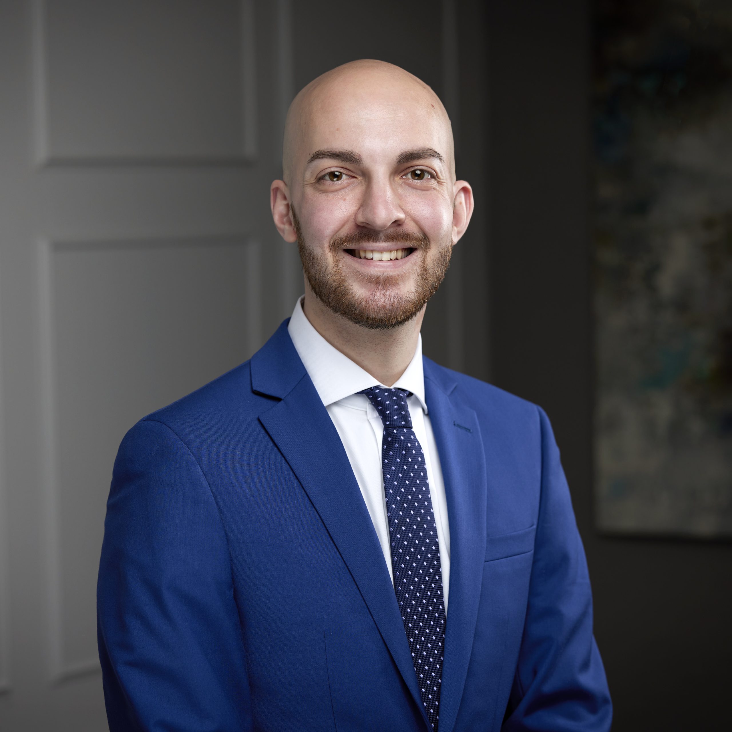 An image of Adam Dingman in the Niagara Region office of DDL & Co.