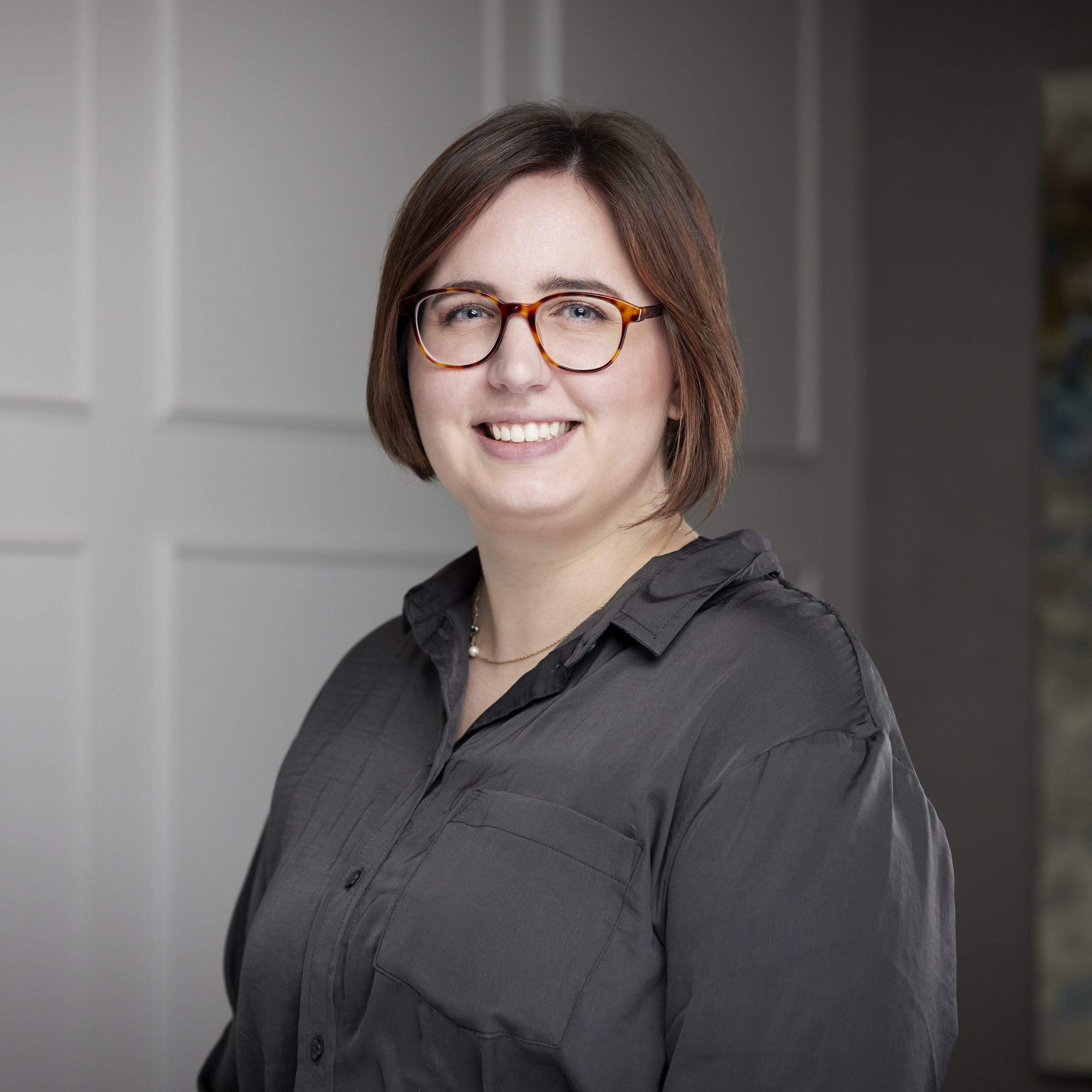 An image of Danielle Hagar in the Niagara Region office of DDL & Co.