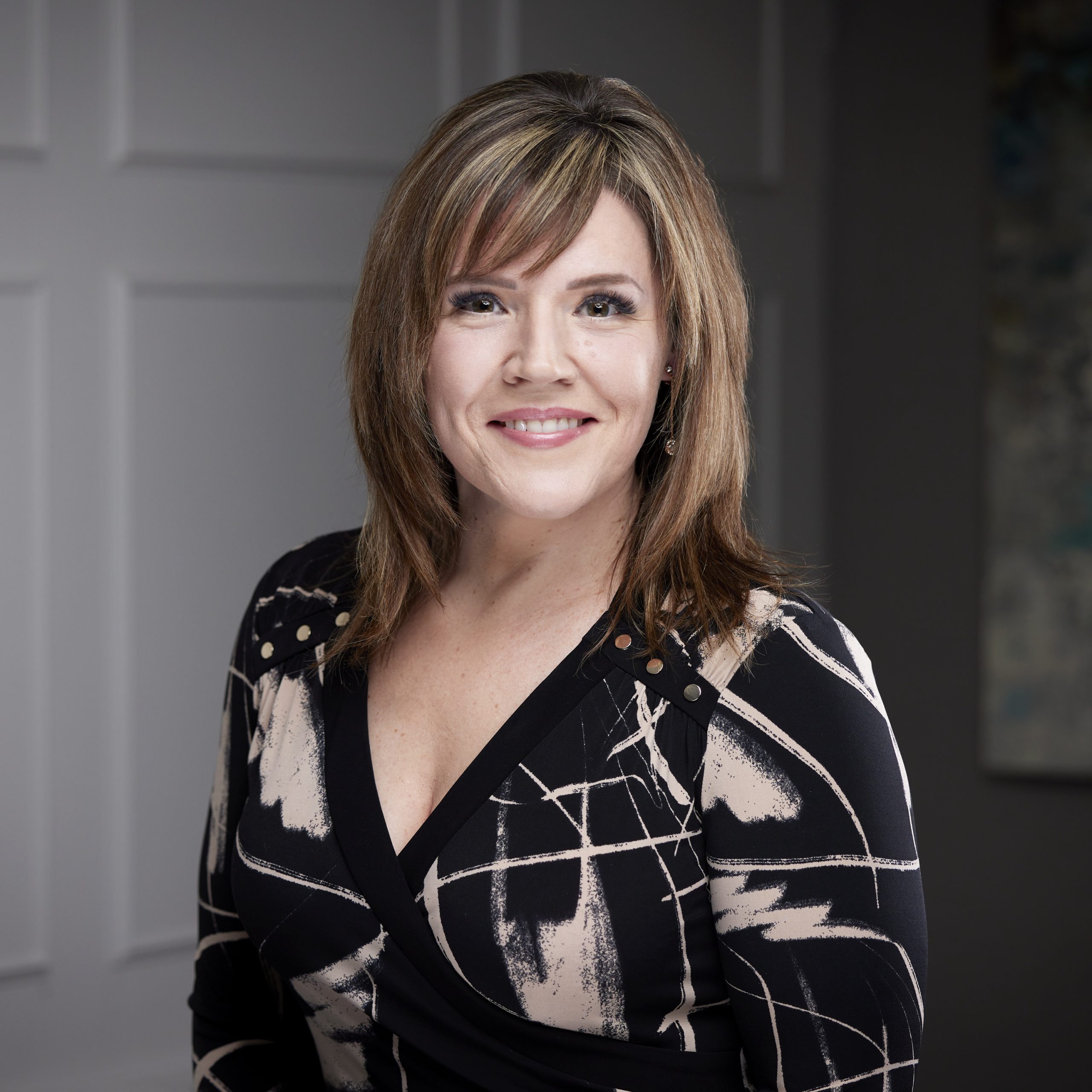 An image of Karen Britton in the Niagara Region office of DDL & Co.