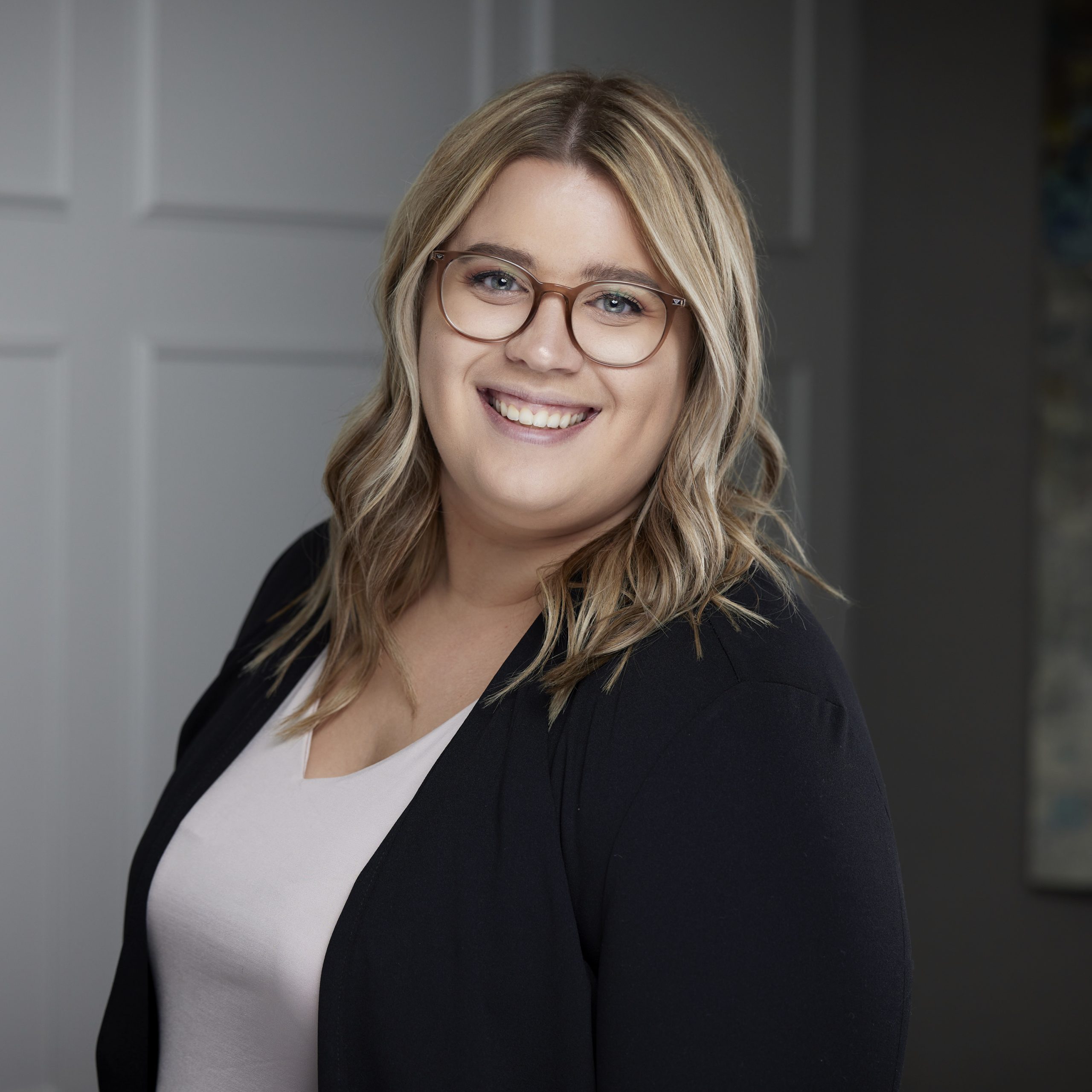 An image of Nicole Swick in the St. Catharines office of DDL & Co.