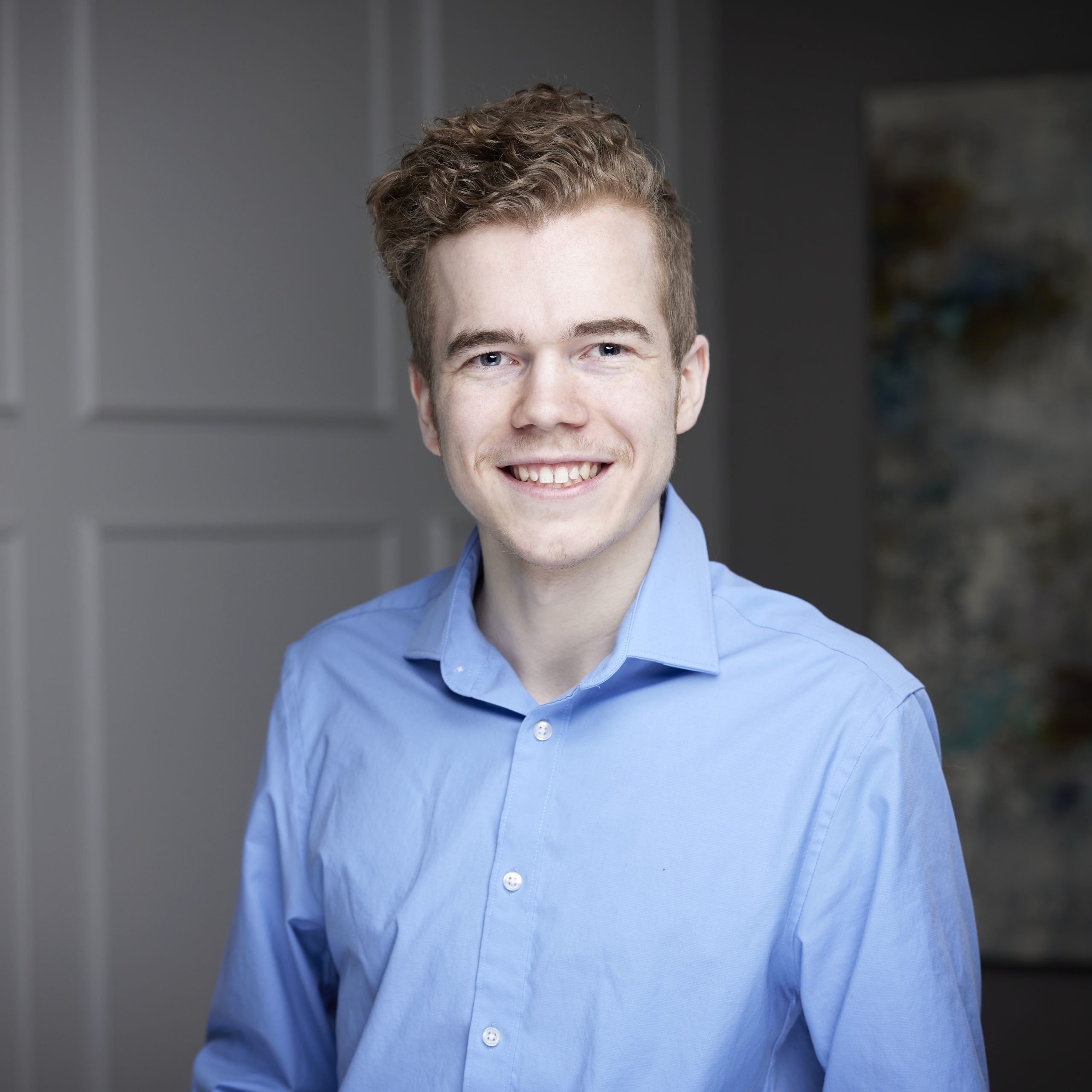 An image of Griffin Sims in the St. Catharines office of DDL & Co.